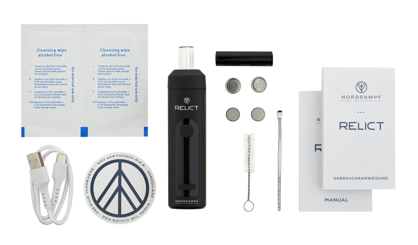 Ein komplettes Set des schwarzen RELICT Vaporizers inklusive USB-C-Kabel, Reinigungstüchern, Ersatzsieben, einer Bürste, einem Werkzeug und Bedienungsanleitungen.