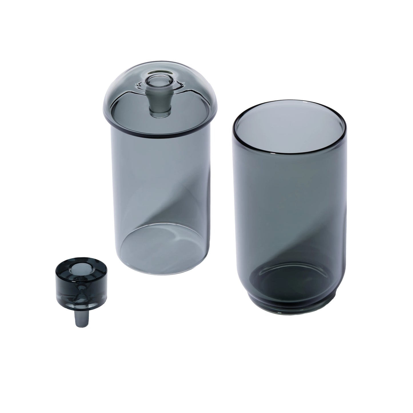 Drei zerlegte Glaskomponenten einer dunkelgrauen Newton Vesper Gravity Pipe: Kopf (Slide), innerer Kern und äußere Hülle.