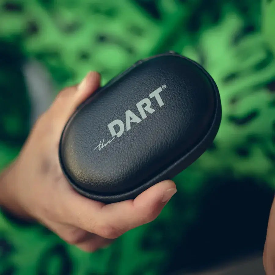 Close-up of the THE DART carry case, showcasing its sleek black design and logo, perfect for storing essentials.