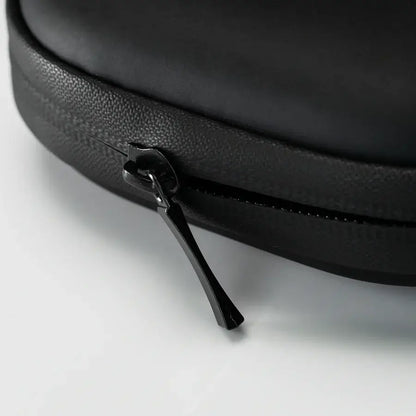 Close-up of the black zip on THE DART carry case, designed for convenient storage of essentials and odor-resistant protection.