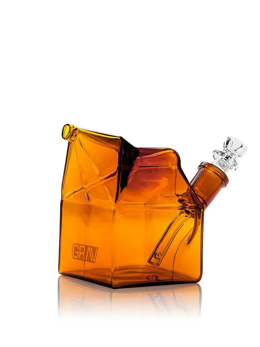 GRAV Milk Carton Bubbler in amber glass, designed for smooth water filtration and unique style. Perfect for relaxed smoking sessions.